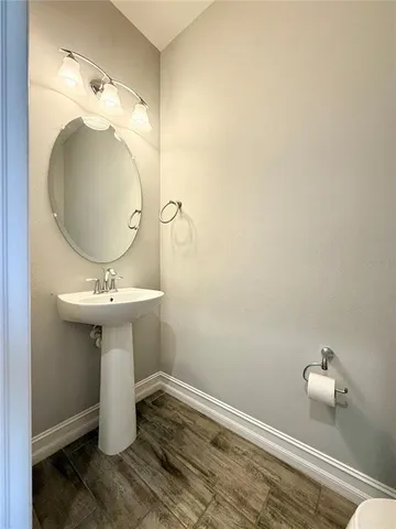 a bathroom with a sink and mirror