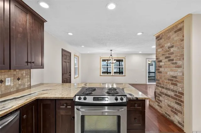 a kitchen with a stove and a sink
