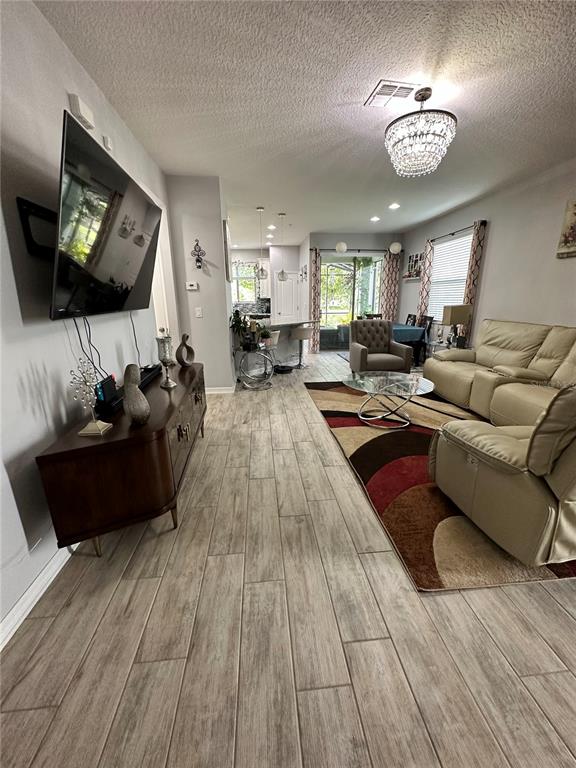 250 Rustic Loop Sanford, FL 32771 - Photo 12 of 33 a living room with furniture and a flat screen tv