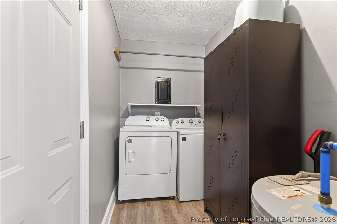 1586 Tom Starling Road Fayetteville, NC 28306 - Photo 16 of 44 a utility room with dryer and washer