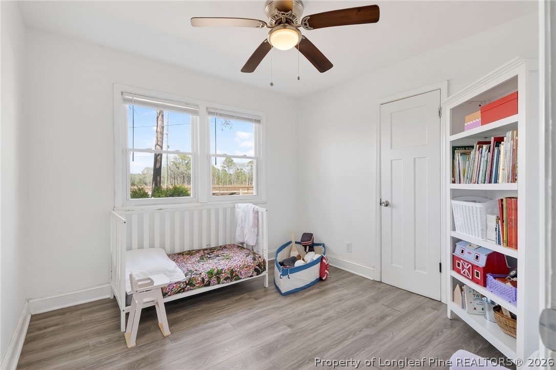 1586 Tom Starling Road Fayetteville, NC 28306 - Photo 19 of 44 a bedroom with bed and a window