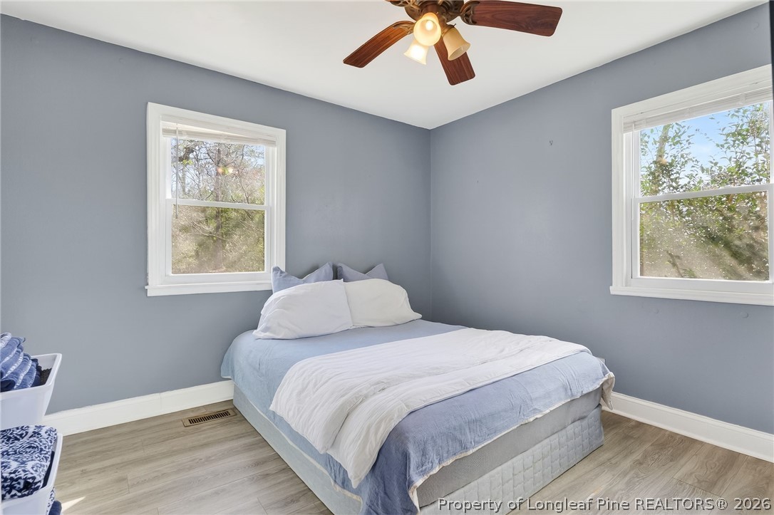1586 Tom Starling Road Fayetteville, NC 28306 - Photo 20 of 44 a bedroom with a large bed and a window