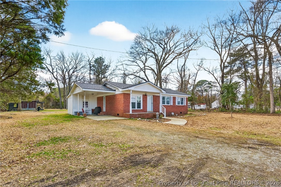 1586 Tom Starling Road Fayetteville, NC 28306 - Photo 2 of 44 a house that has a backyard