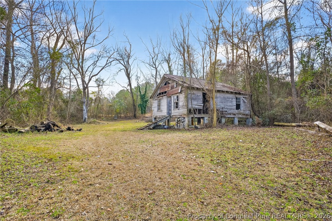 1586 Tom Starling Road Fayetteville, NC 28306 - Photo 28 of 44 a front view of house with yard