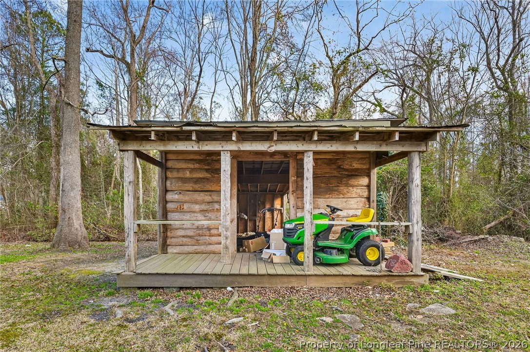 1586 Tom Starling Road Fayetteville, NC 28306 - Photo 33 of 44 a front view of a house with garden