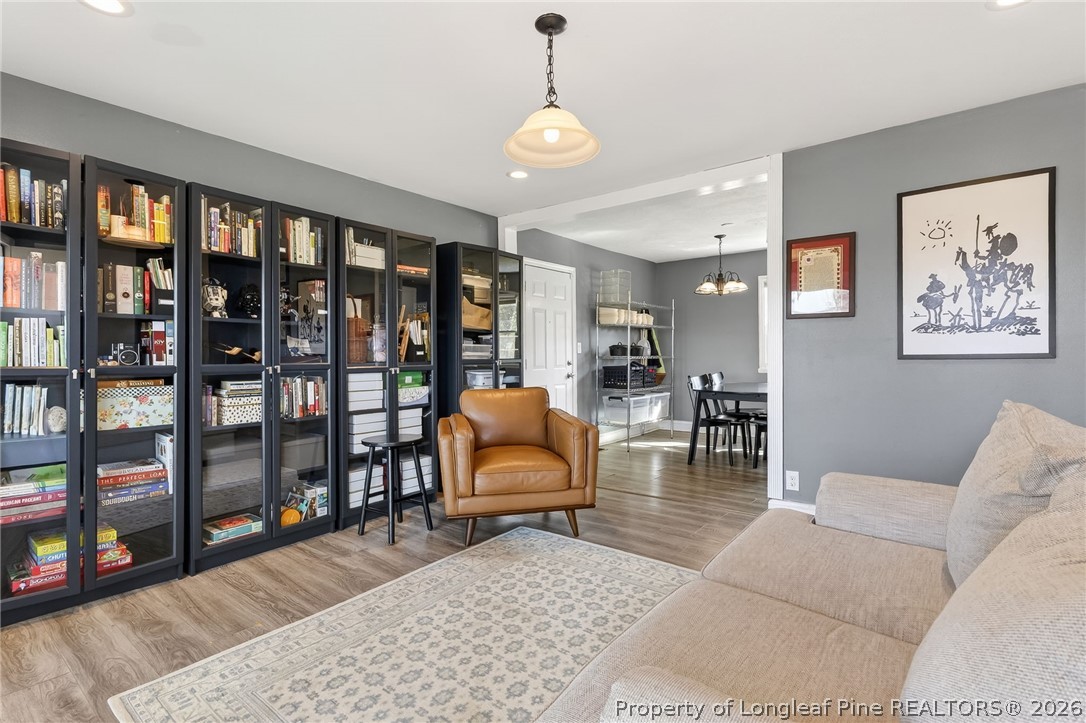 1586 Tom Starling Road Fayetteville, NC 28306 - Photo 7 of 44 a living room with furniture ceiling fan and a window