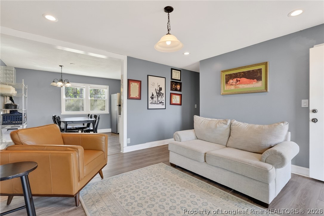 1586 Tom Starling Road Fayetteville, NC 28306 - Photo 8 of 44 a living room with furniture and a flat screen tv