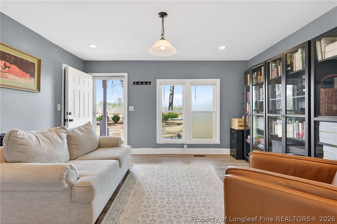 1586 Tom Starling Road Fayetteville, NC 28306 - Photo 9 of 44 a living room with furniture and a window