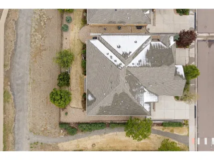 a aerial view of a house with a yard