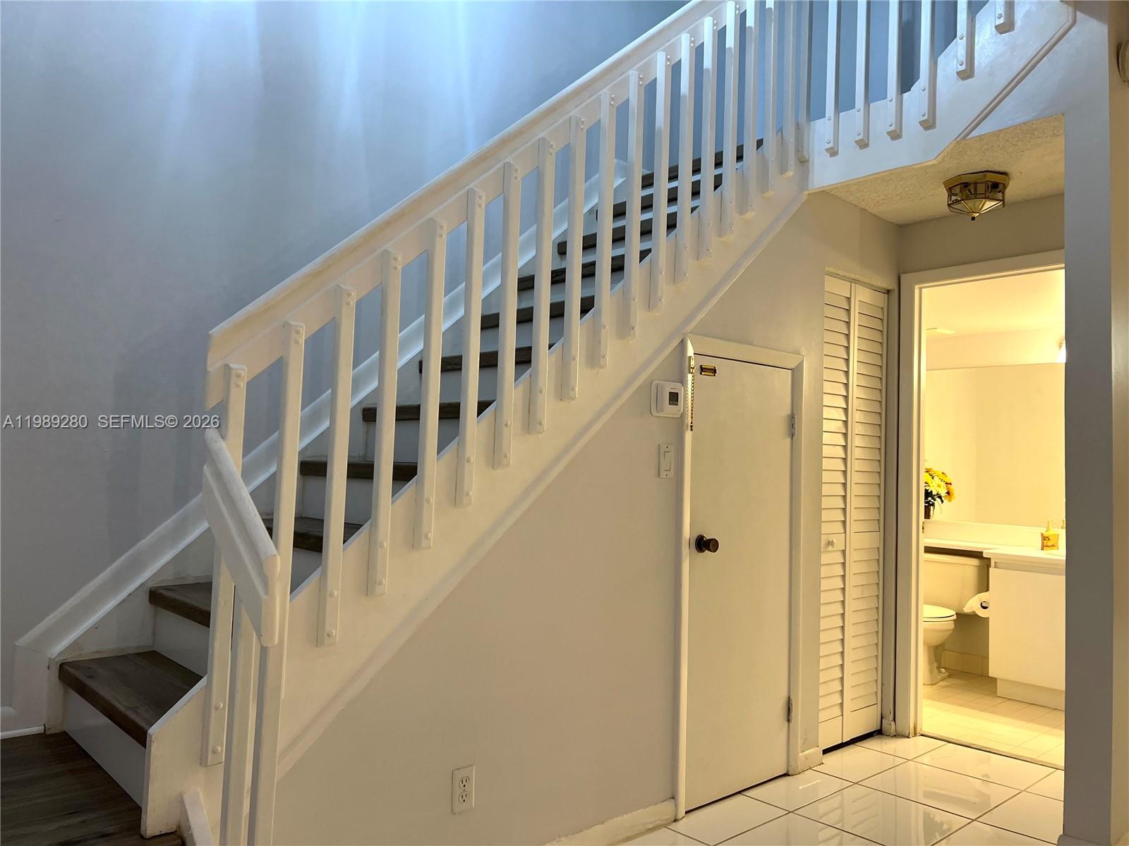543 Racquet Club Road, Unit 33 Weston, FL 33326 - Photo 5 of 28 a view of entryway with wooden floor and windows