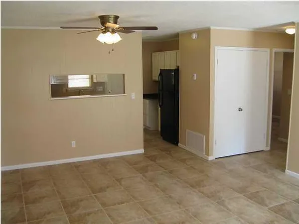 a view of a room with a ceiling fan