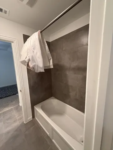 a view of staircase with white walls and a window