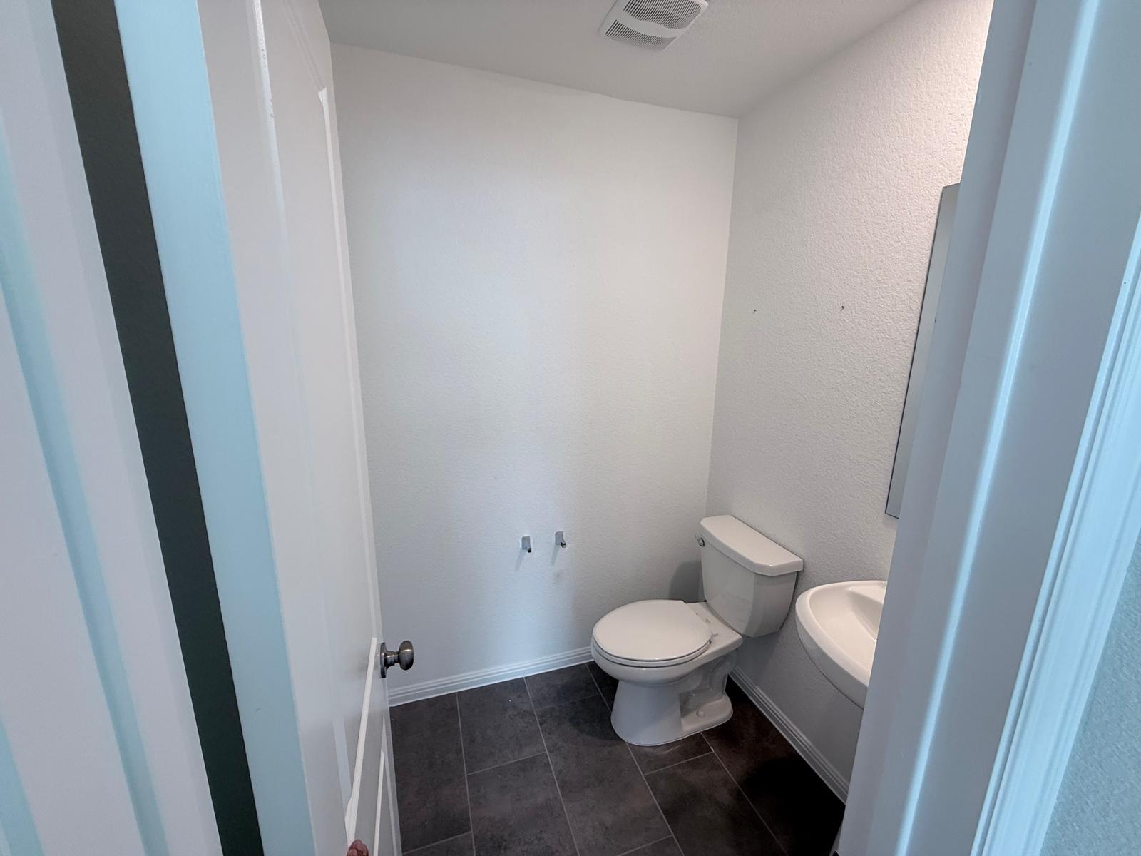 160 Venti Cove Georgetown, TX 78628 - Photo 12 of 40 a white toilet sitting next to a sink