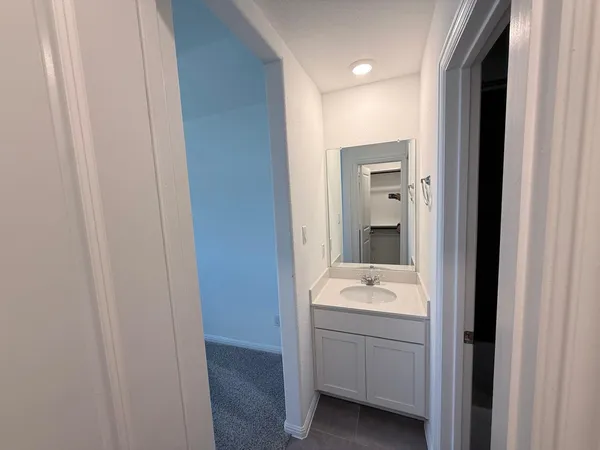 a bathroom with a tub and shower