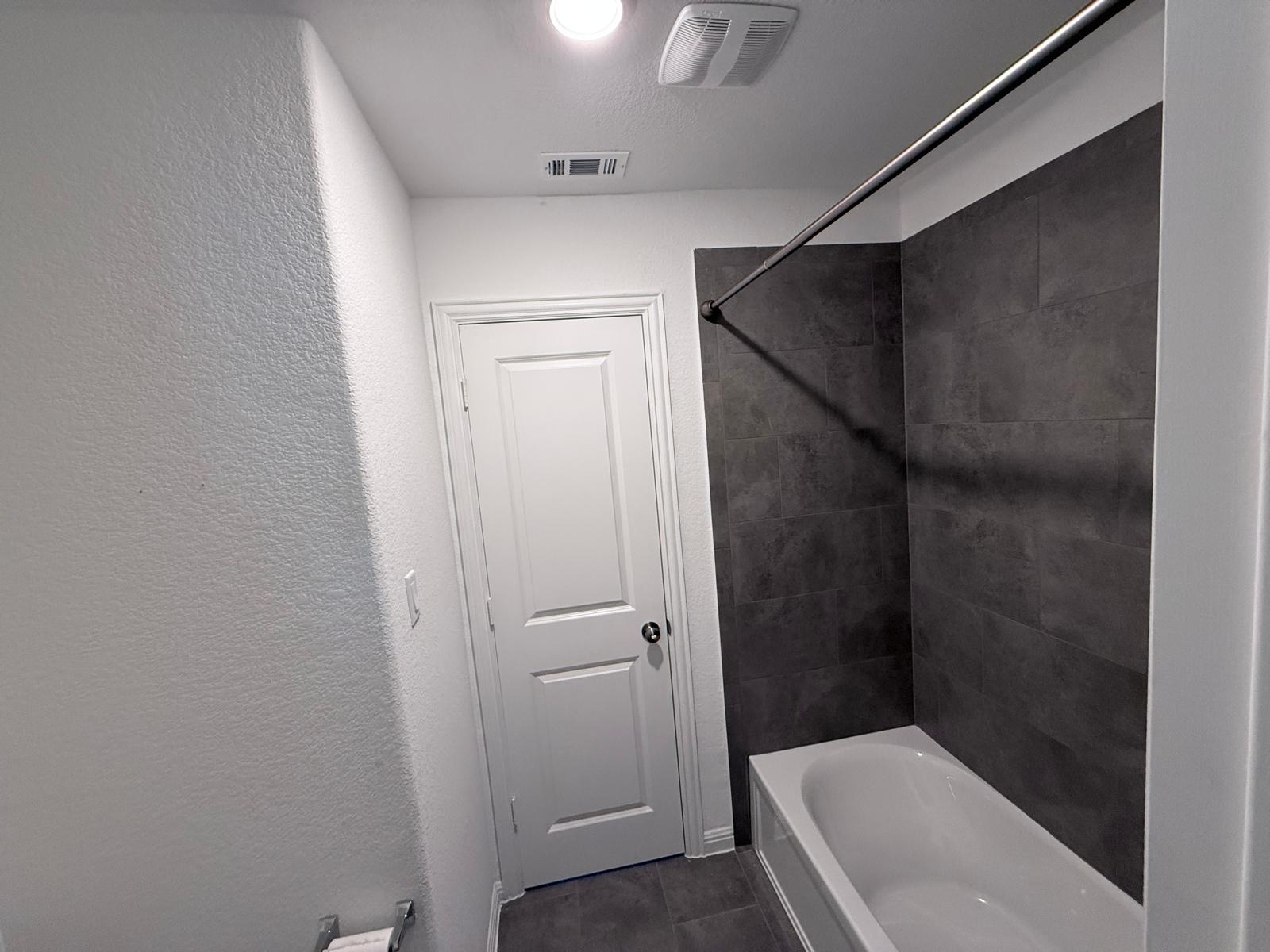 160 Venti Cove Georgetown, TX 78628 - Photo 15 of 40 a bathroom with a tub and shower