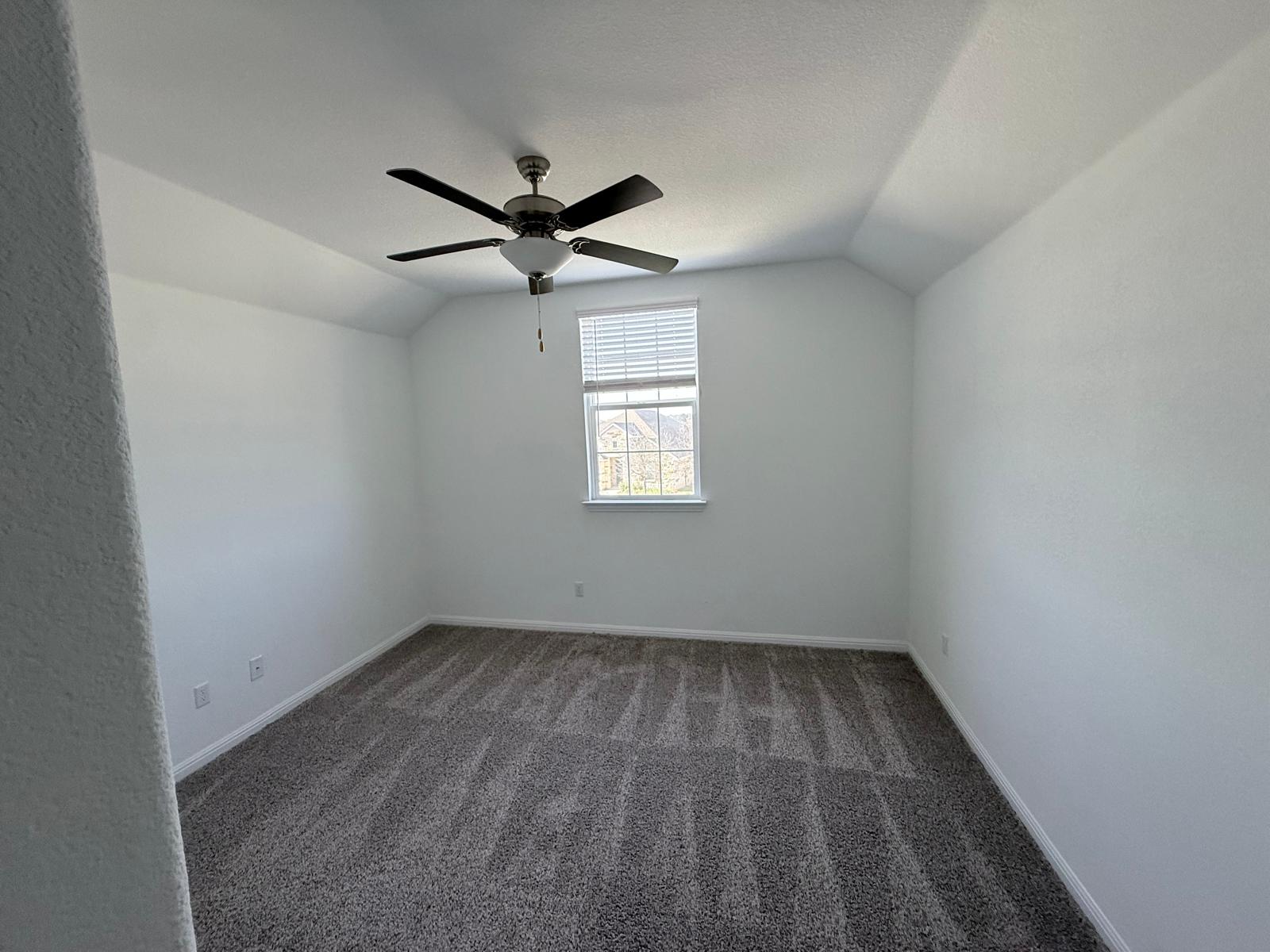 160 Venti Cove Georgetown, TX 78628 - Photo 16 of 40 an empty room with a window and a fan