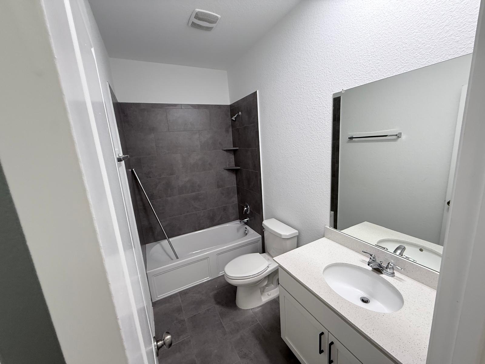 160 Venti Cove Georgetown, TX 78628 - Photo 19 of 40 a bathroom with a sink a toilet and shower