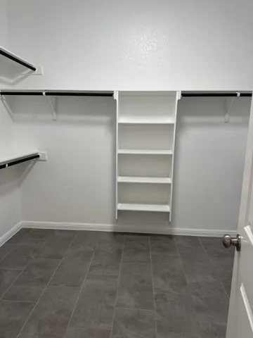 a view of a room with shelf on the wall