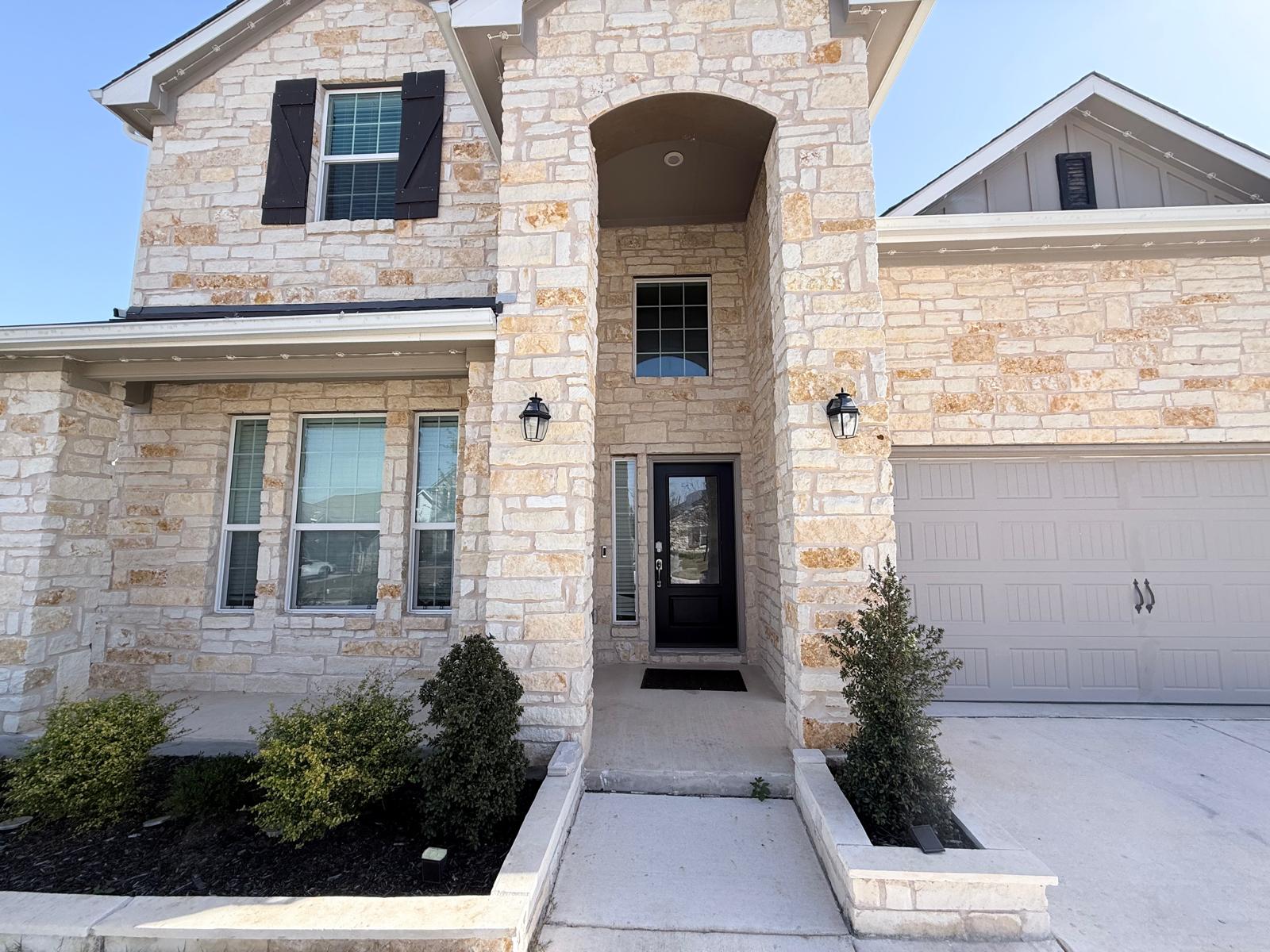160 Venti Cove Georgetown, TX 78628 - Photo 2 of 40 a front view of a house with a yard