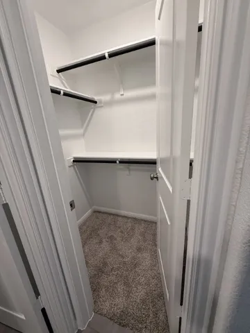 a view of an empty walk in closet