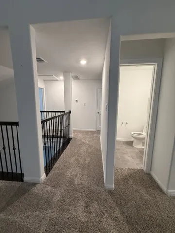 a living room with furniture fireplace and a window