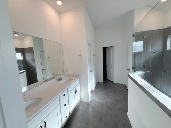 a kitchen with stainless steel appliances and wooden cabinets