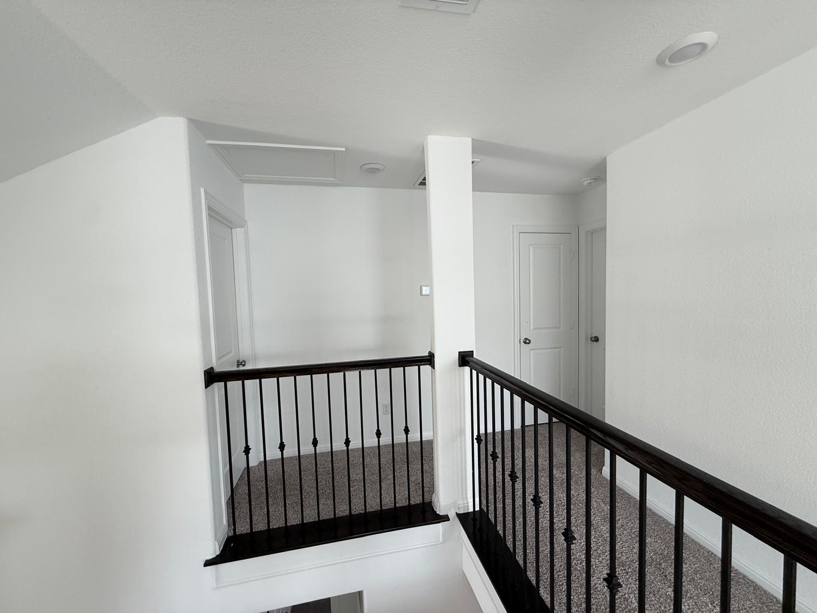 160 Venti Cove Georgetown, TX 78628 - Photo 34 of 40 a view of a hallway with wooden floor