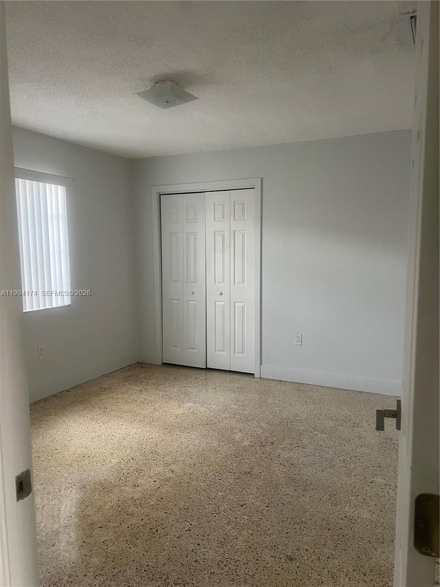 3279 Southwest 25th Terrace, Unit 3279 Miami, FL 33133 - Photo 4 of 6 an empty room with windows