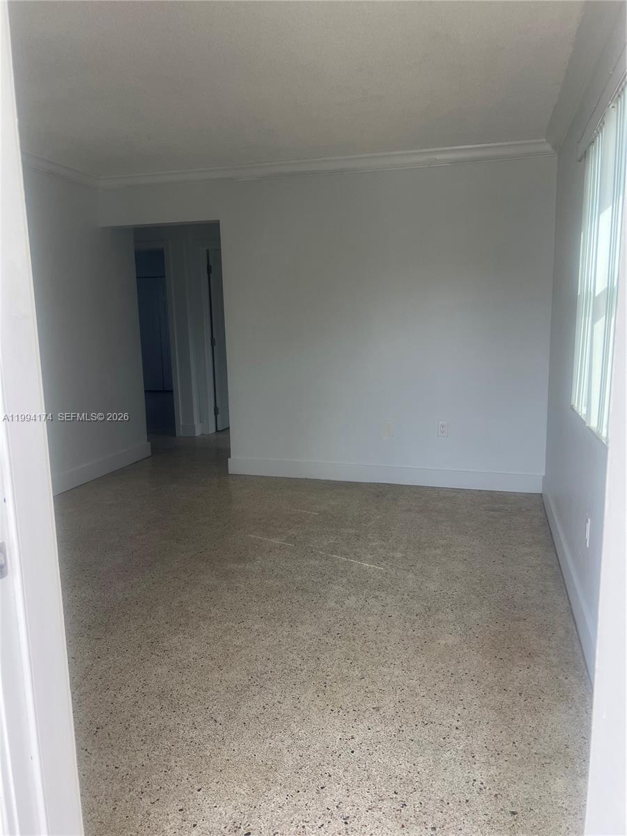 3279 Southwest 25th Terrace, Unit 3279 Miami, FL 33133 - Photo 6 of 6 an empty room with windows