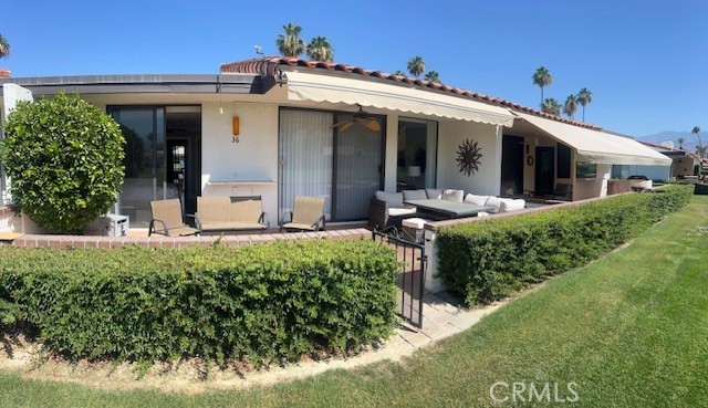 36 El Toro Drive Rancho Mirage, CA 92270 - Photo 11 of 25 front view of a house with a yard