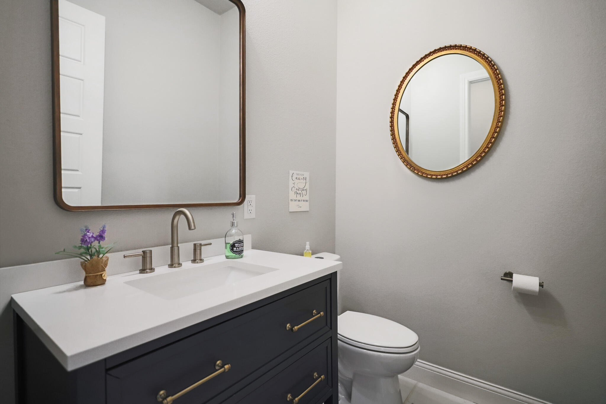 301 Fagan Road Snyder, TX 79549 - Photo 72 of 102 a bathroom with a toilet a sink and a mirror