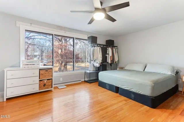 a bedroom with a bed and a fireplace