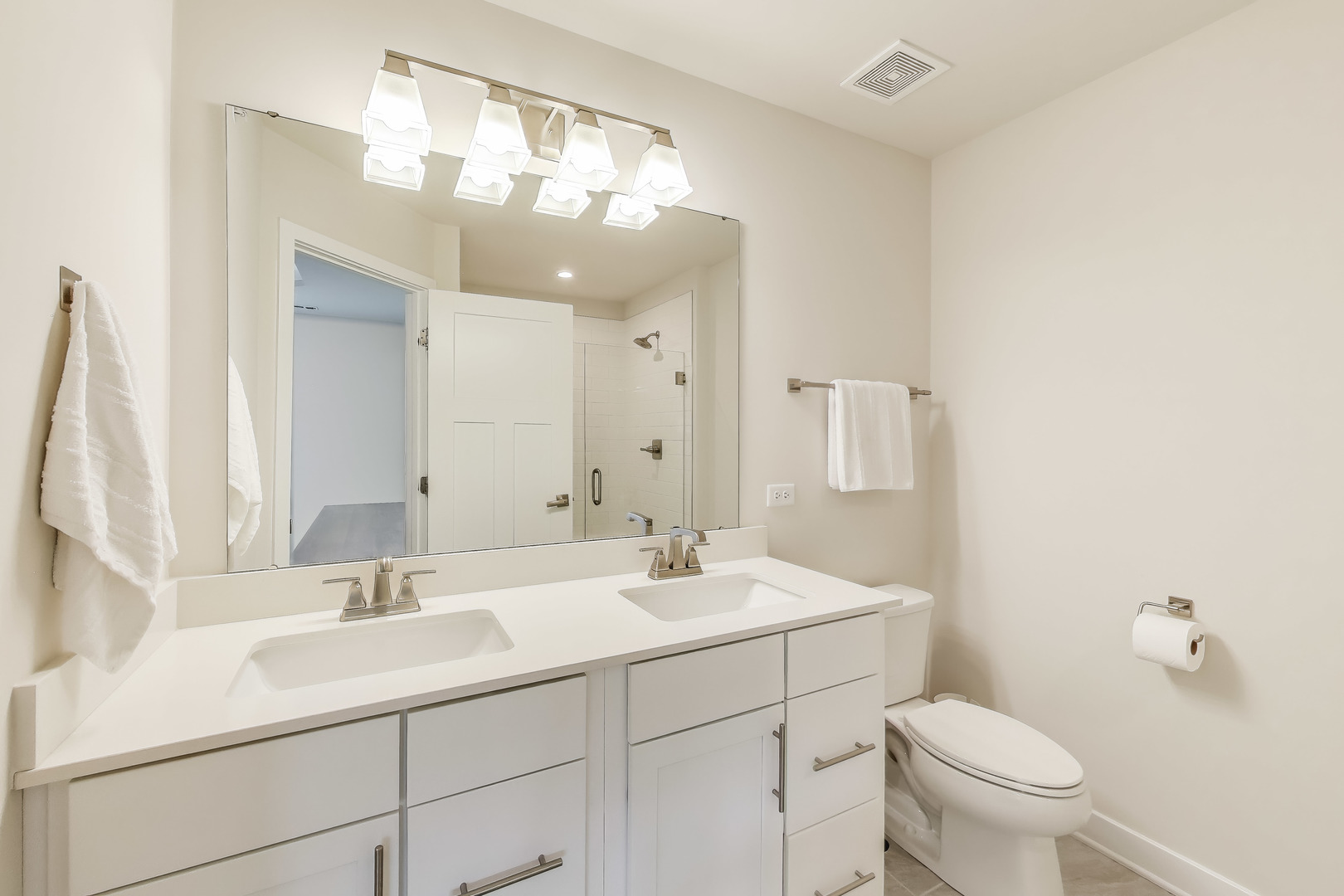 205 Dawson Drive Mount Prospect, IL 60056 - Photo 17 of 28 a bathroom with a sink a toilet and a mirror