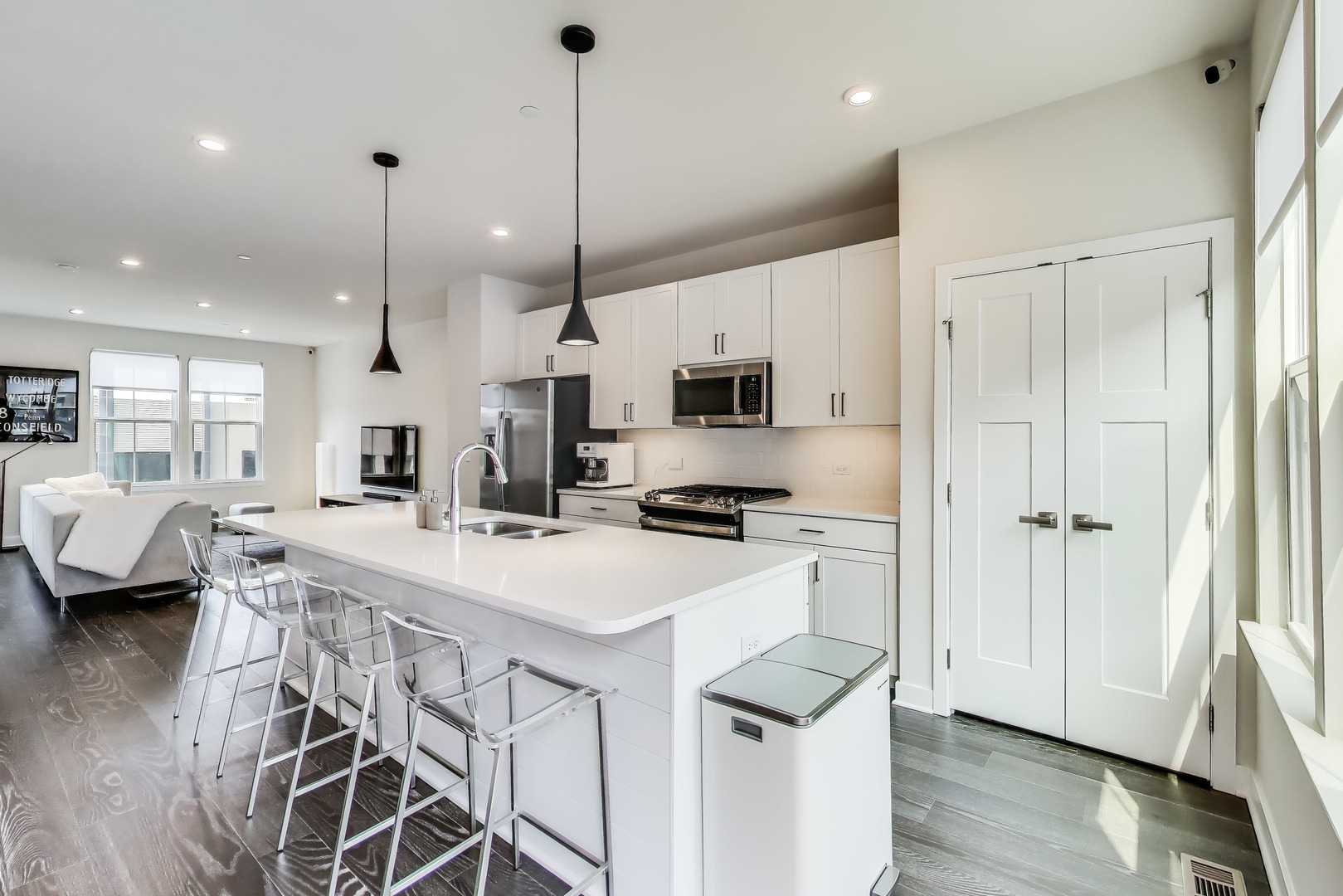 205 Dawson Drive Mount Prospect, IL 60056 - Photo 8 of 28 a kitchen that has a lot of white cabinets and wooden floor