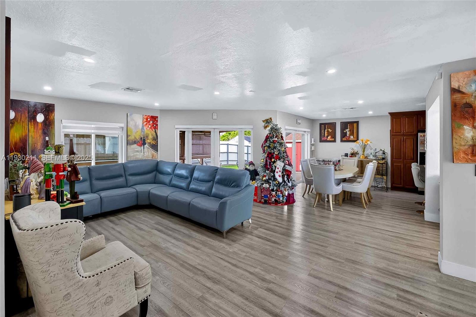20810 Southwest 125th Court Road Miami, FL 33177 - Photo 11 of 52 a living room with furniture and a wooden floor