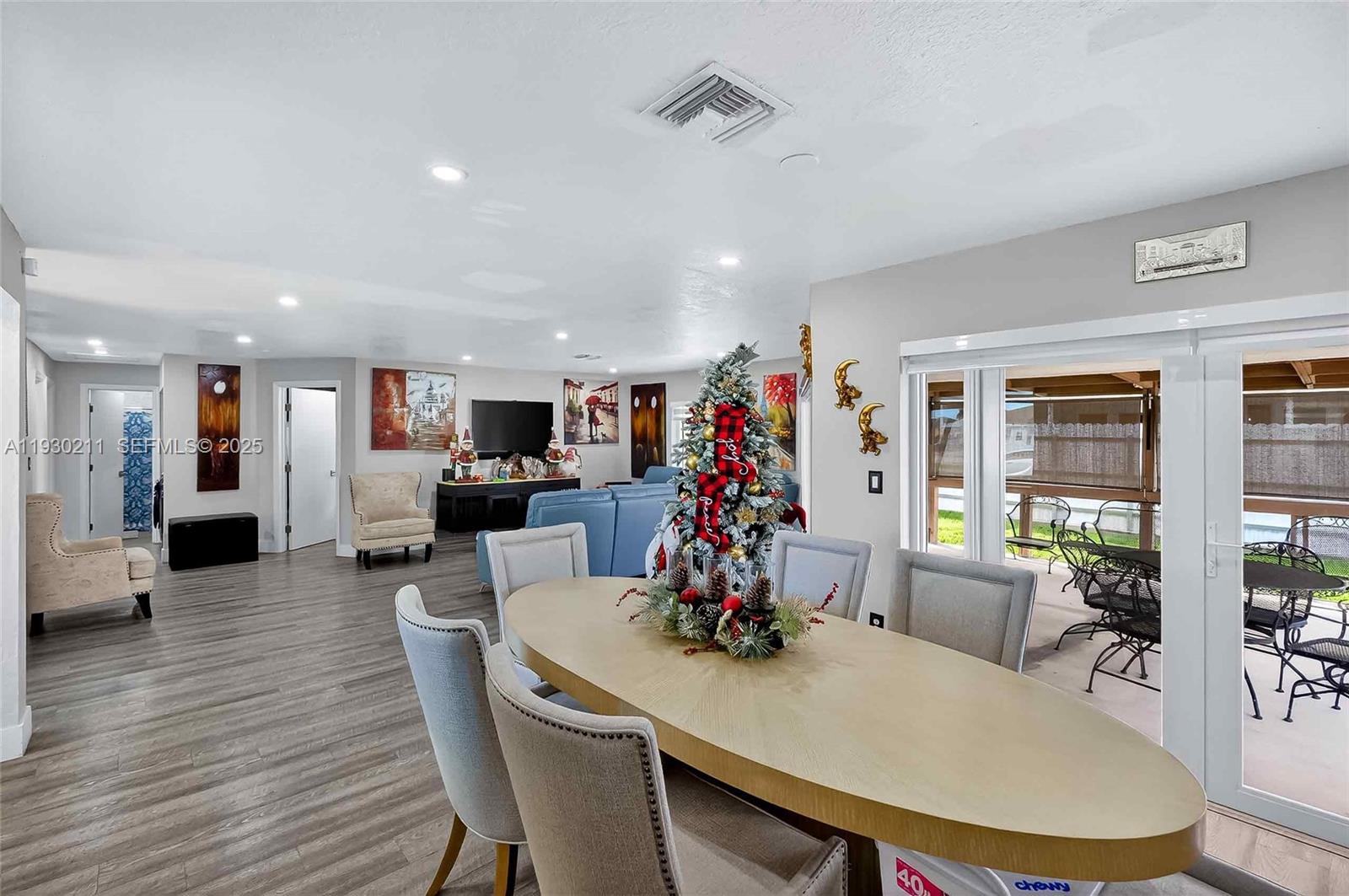 20810 Southwest 125th Court Road Miami, FL 33177 - Photo 14 of 52 a view of a dining room with furniture window and wooden floor