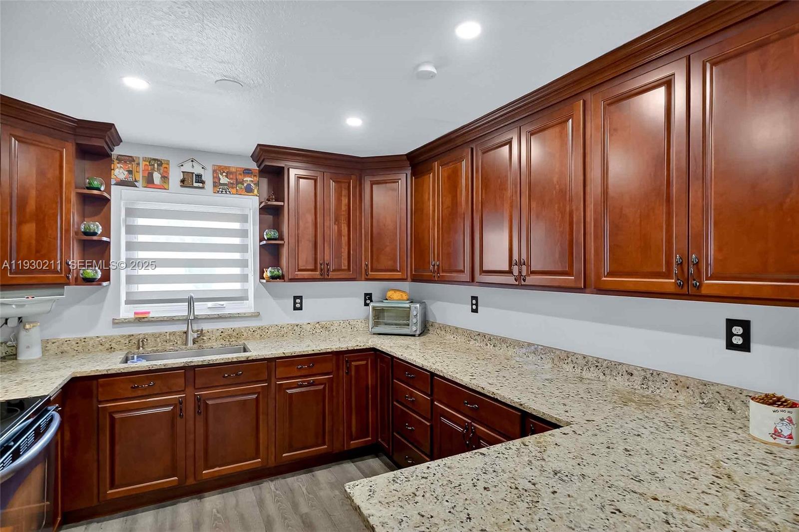 20810 Southwest 125th Court Road Miami, FL 33177 - Photo 16 of 52 a kitchen with large cabinets a sink and dishwasher