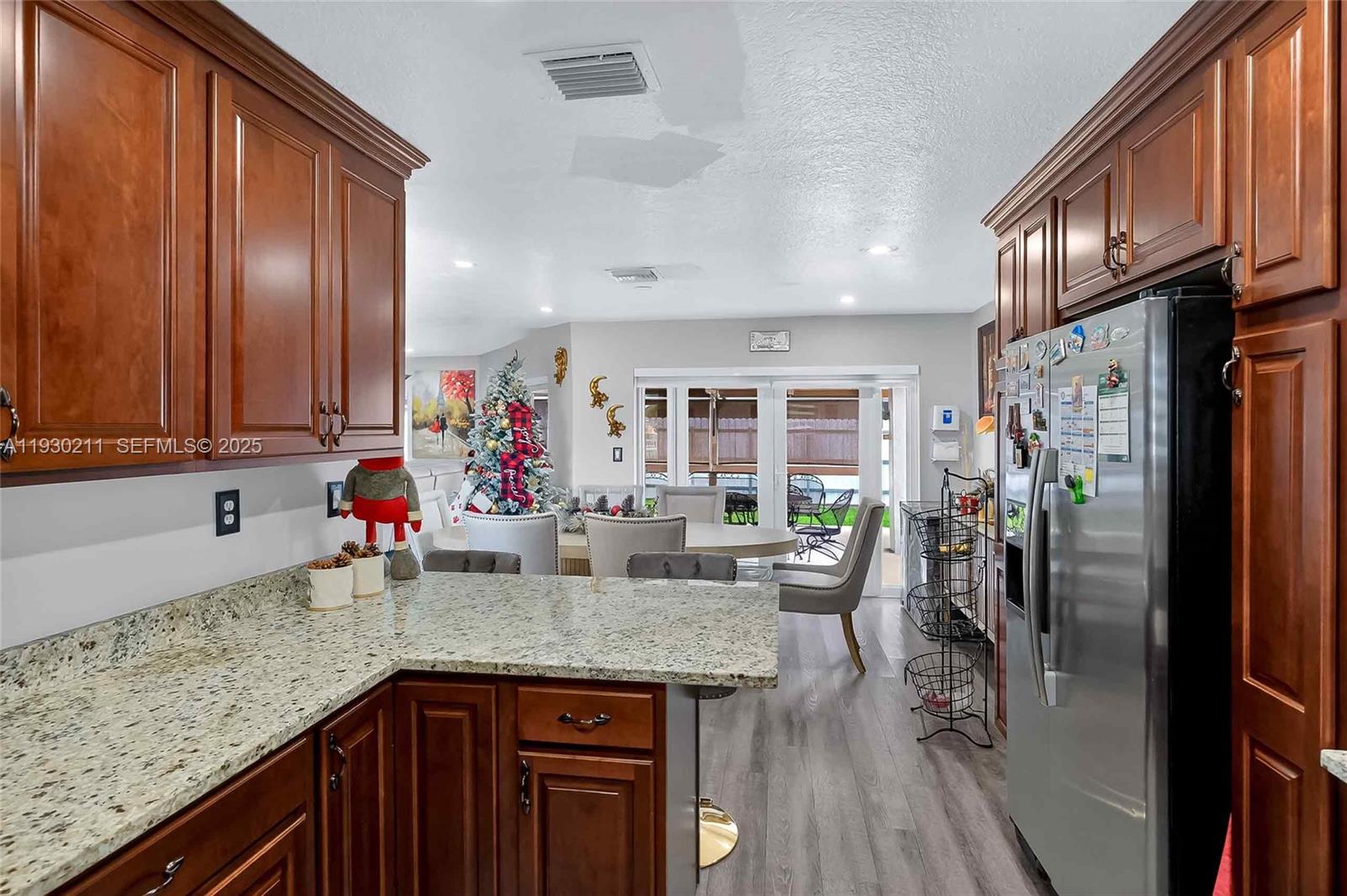 20810 Southwest 125th Court Road Miami, FL 33177 - Photo 18 of 52 a kitchen with stainless steel appliances granite countertop a refrigerator and a sink