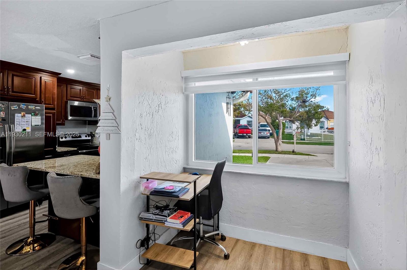 20810 Southwest 125th Court Road Miami, FL 33177 - Photo 20 of 52 a view of a workspace with furniture and a window