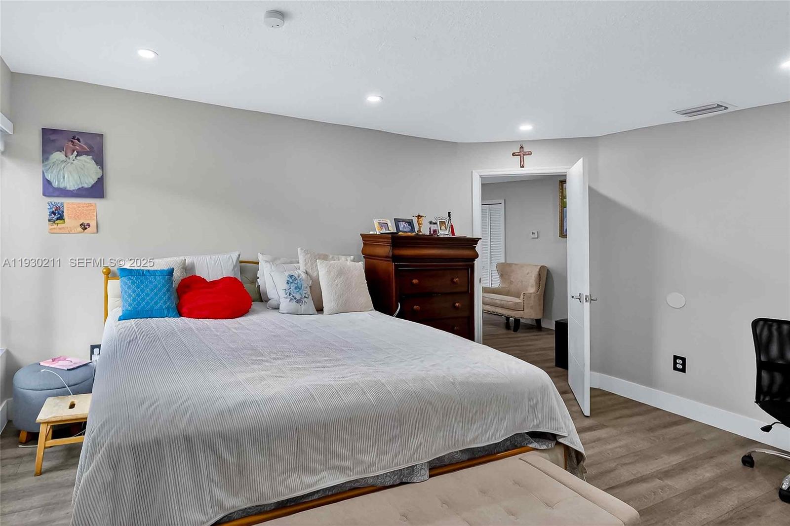 20810 Southwest 125th Court Road Miami, FL 33177 - Photo 23 of 52 a bedroom with a bed and a dresser