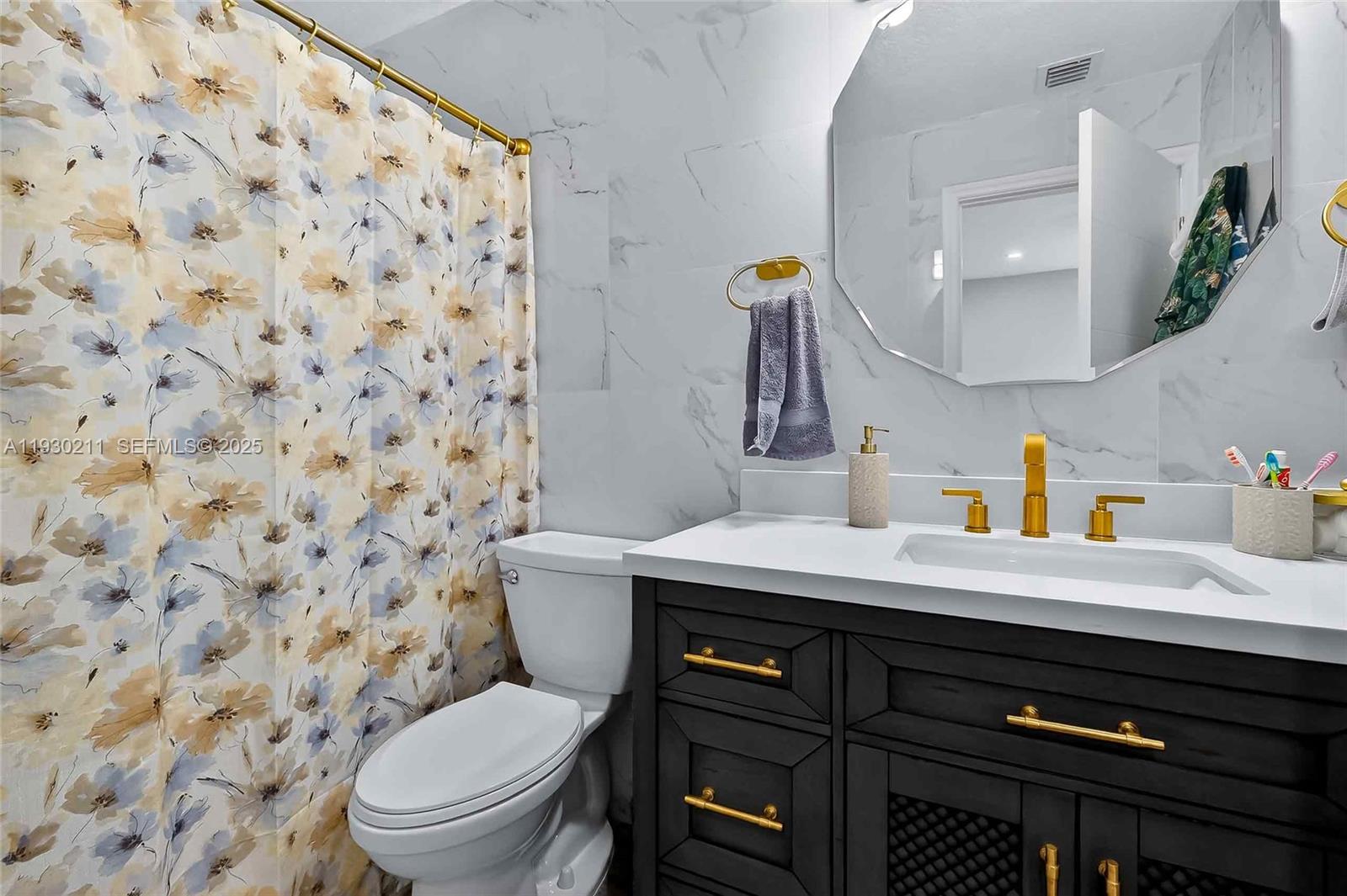 20810 Southwest 125th Court Road Miami, FL 33177 - Photo 25 of 52 a bathroom with a sink toilet and shower