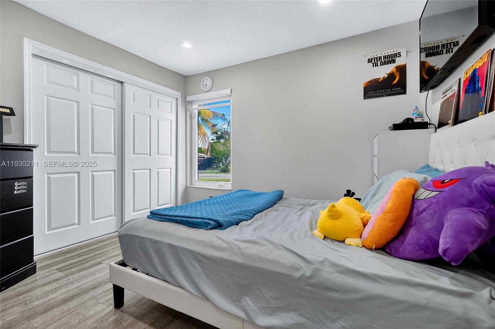 20810 Southwest 125th Court Road Miami, FL 33177 - Photo 26 of 52 a bedroom with a bed and a window