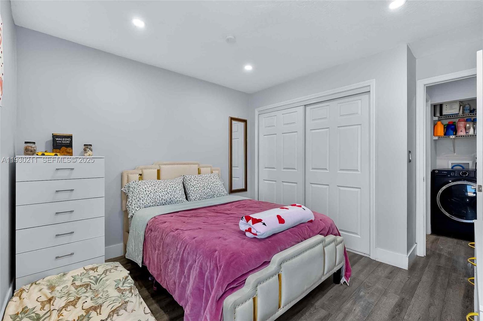 20810 Southwest 125th Court Road Miami, FL 33177 - Photo 31 of 52 a bedroom with a bed and a closet