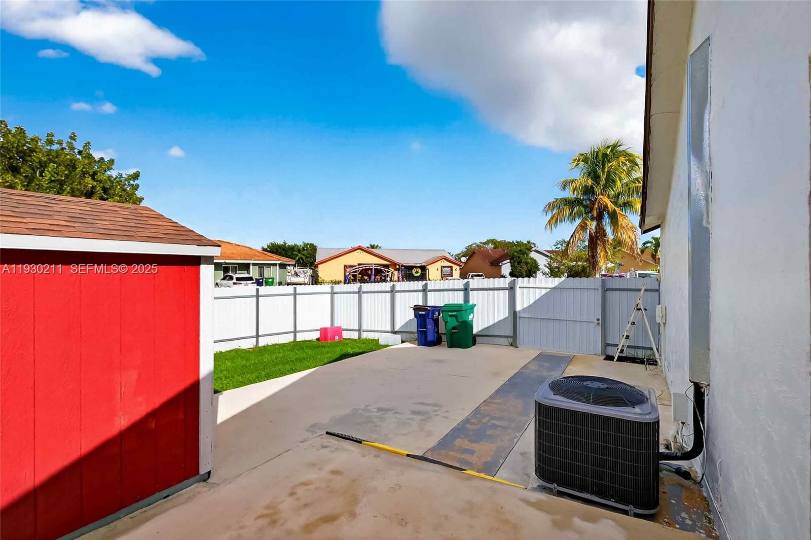 20810 Southwest 125th Court Road Miami, FL 33177 - Photo 38 of 52 a view of houses with an outdoor space and seating