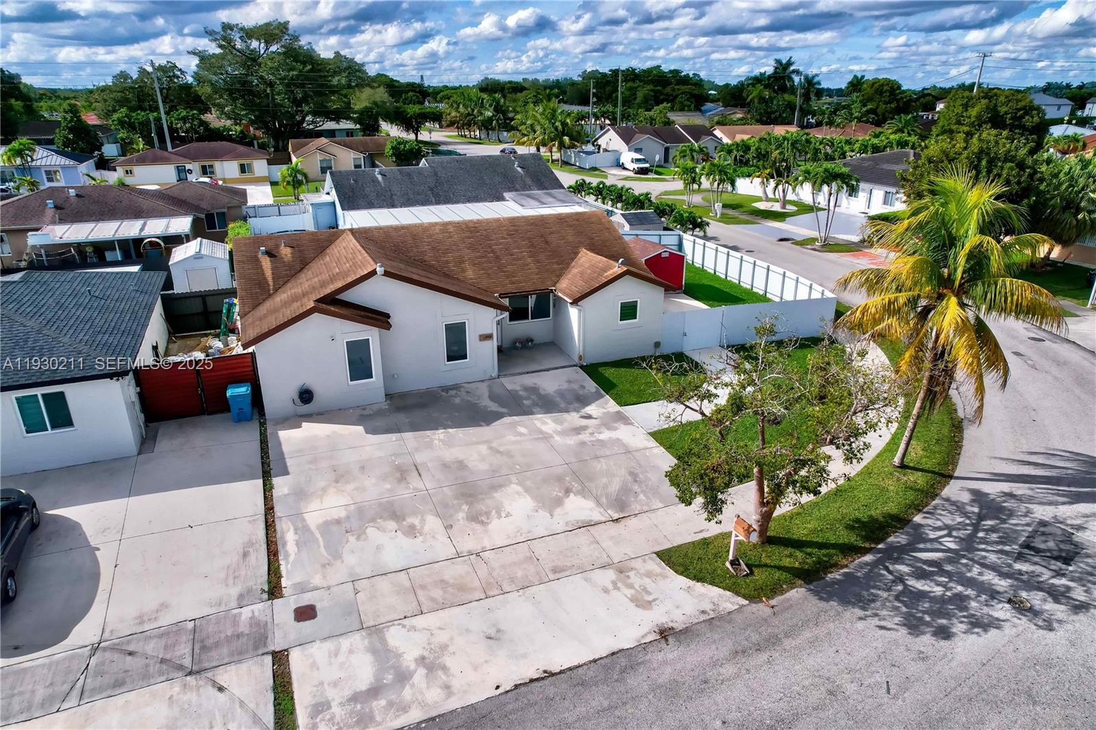 20810 Southwest 125th Court Road Miami, FL 33177 - Photo 44 of 52 an aerial view of a house with a yard