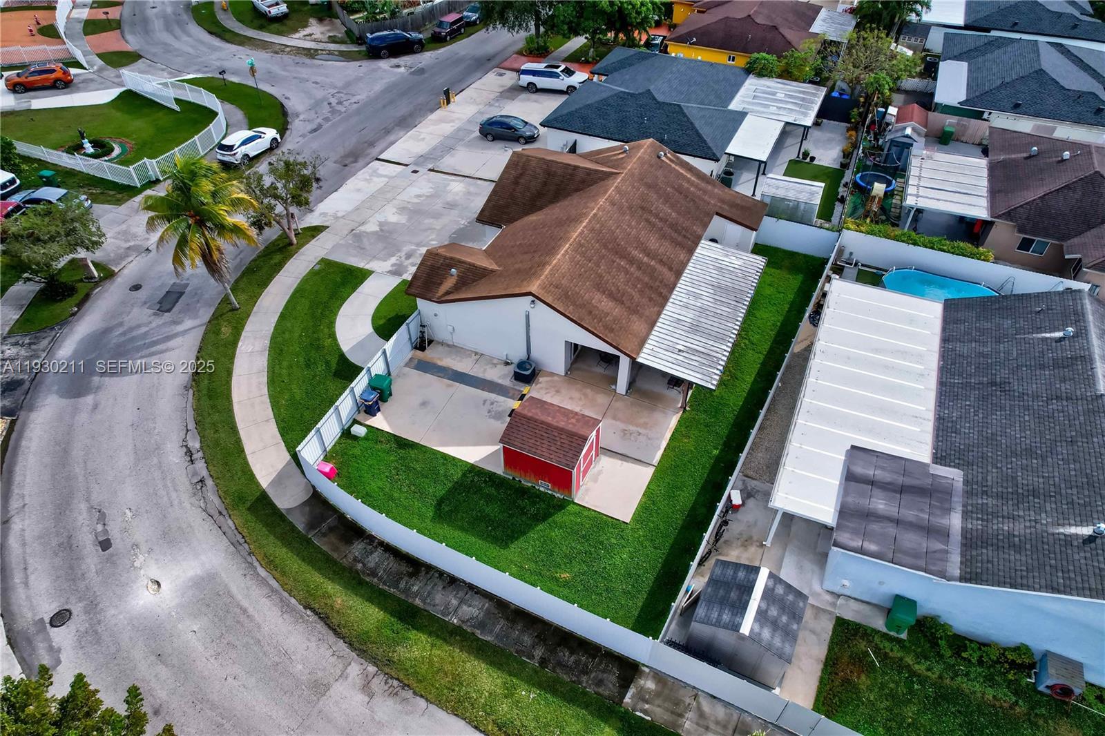 20810 Southwest 125th Court Road Miami, FL 33177 - Photo 5 of 52 an aerial view of a house with a garden and swimming pool