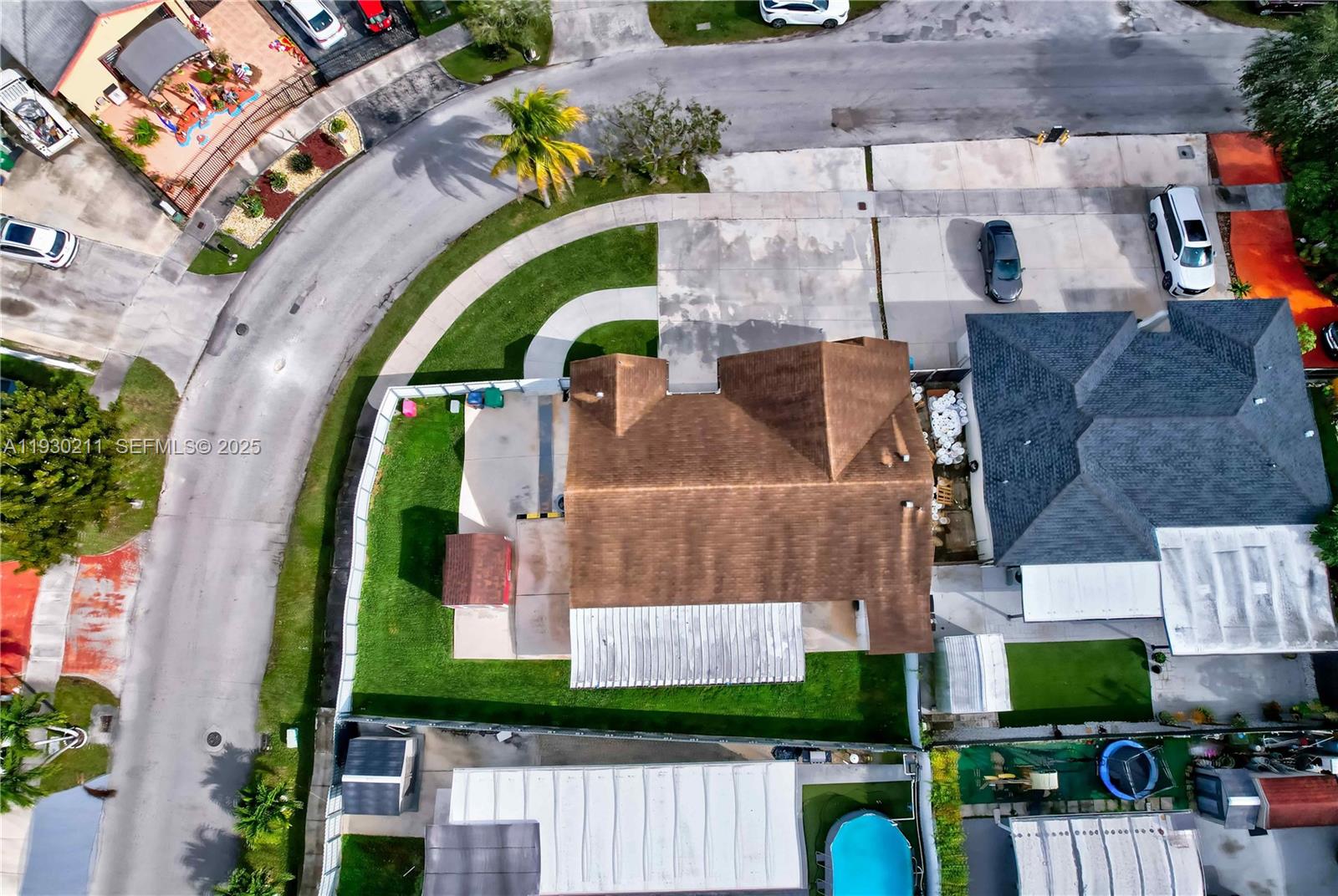 20810 Southwest 125th Court Road Miami, FL 33177 - Photo 51 of 52 an aerial view of a house with a garden and a swimming pool