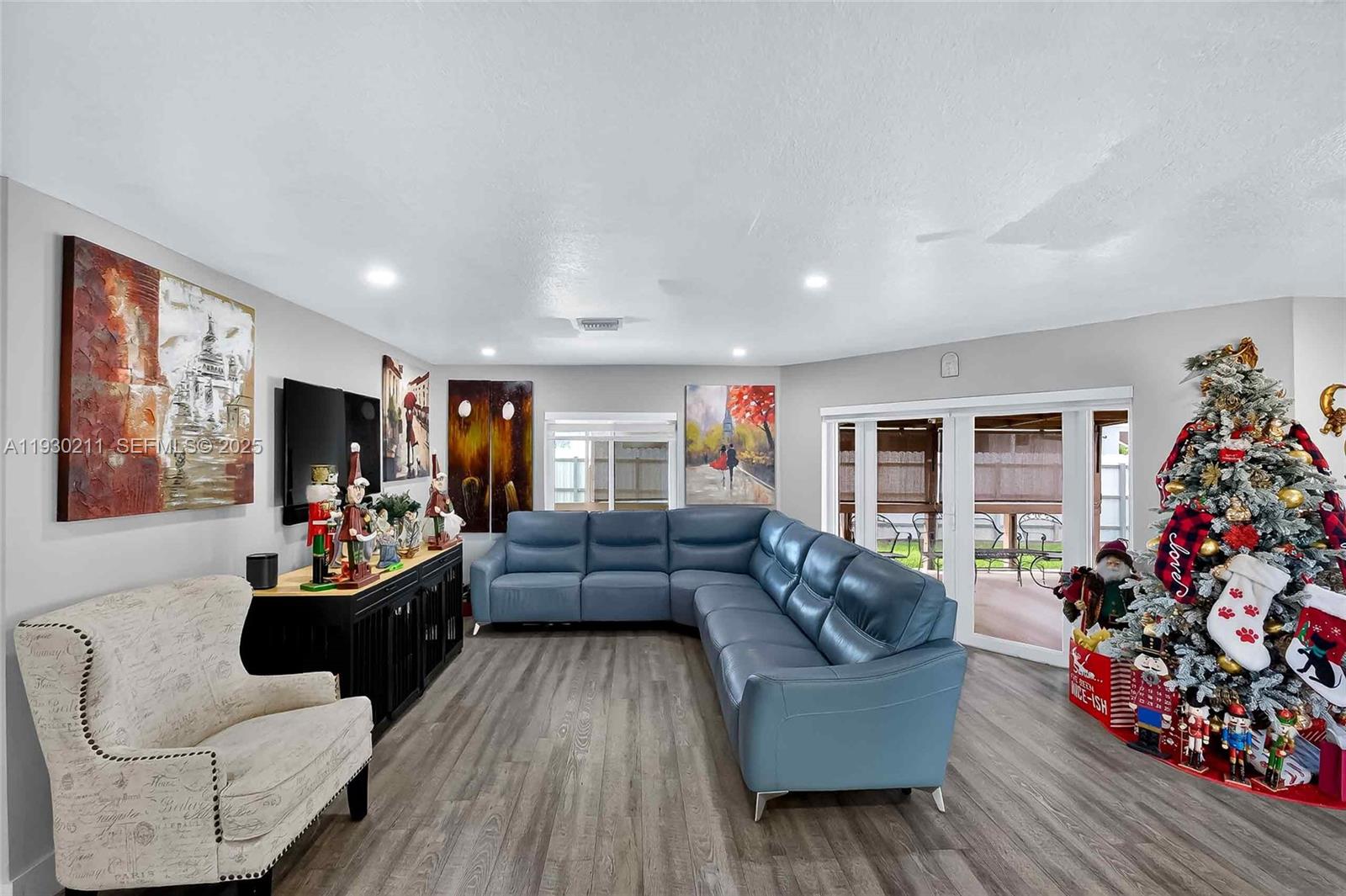20810 Southwest 125th Court Road Miami, FL 33177 - Photo 10 of 52 a living room with furniture and a large window