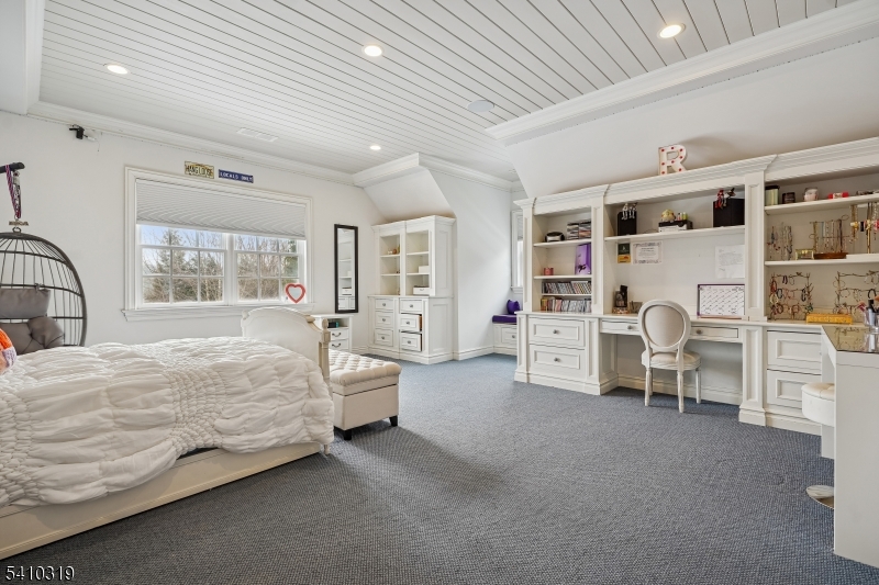 91 Mosle Road Peapack-Gladstone, NJ 07931 - Photo 27 of 37 a bed room with a bed and a chair