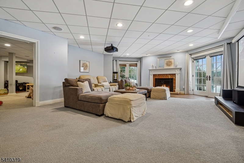 91 Mosle Road Peapack-Gladstone, NJ 07931 - Photo 33 of 37 a living room with furniture and a fireplace